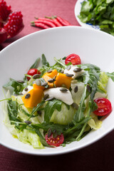Fresh green vegetarian salad with pumpkin and seeds