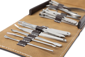 Manicure set in case on white background, closeup