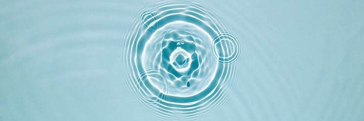 Blue water texture, blue mint water surface with rings and ripples. Spa concept background. Flat...