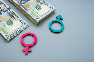 Money and symbols as gender inequality or pay gap.