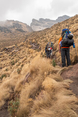 Obraz premium Mountaineer seen from the back looking up the mountain