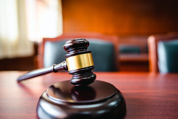 Wooden court gavel on wood table in courtroom,judge and trial. Auction. Law and Justice, Legality...