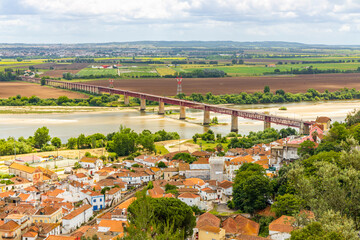 The architecture of Santarem surrounded by green fields and Tagus river, Portugal