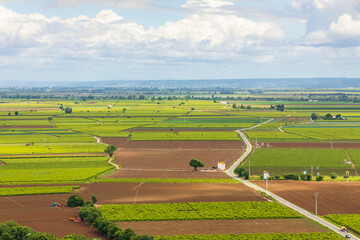 Fototapeta premium Agricultural fields landscape with dramatic sky.