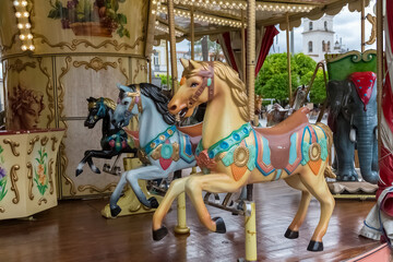 View of colorful horses from a vintage classic carousel