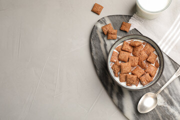 Bowl with tasty corn pads and milk on light table, flat lay. Space for text