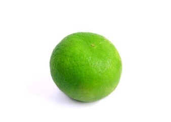 one fresh green lemon on a white background