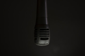 black microphone on gray background,