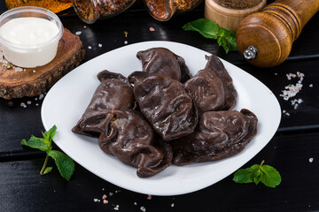 Serving chocolate dumplings with cocoa