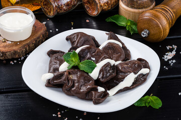Serving chocolate dumplings with cocoa