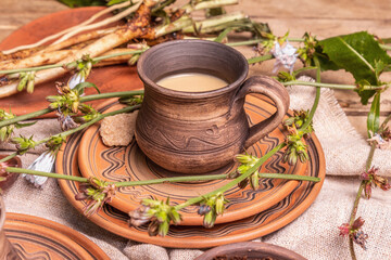 Hot natural chicory caffeine free drink in ceramic cups on a wooden table