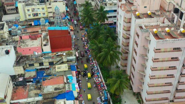 Aerial tilt up of congested urban street in Bangalore India