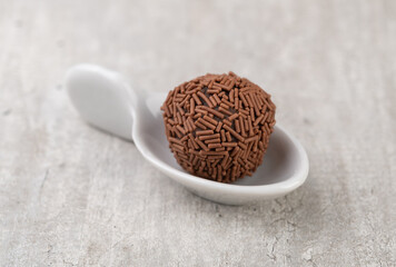 Typical brazilian chocolate brigadeiro on a spoon