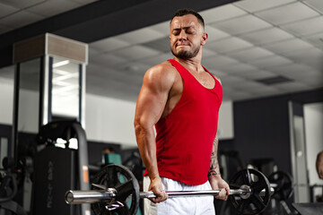 Fototapeta na wymiar Strong man athlete exercise in gym, close up portrait