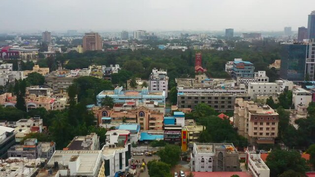 Flying toward lush greenery in city of Bangalore India