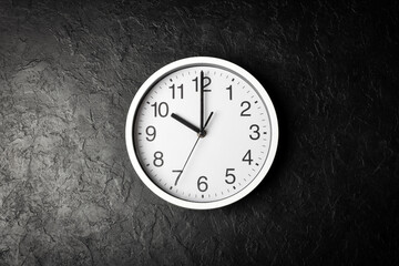 Clock on the black texture background