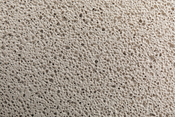 Texture of white pumice stone as background, closeup