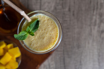 Indian cocktail, drink Mango Lassi with honey and crushed ice.