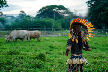 Tribal costume and his cow