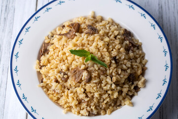 Turkish foods; Bulgur pilaf with mushrooms (Turkish name; mantarli bulgur pilavi)