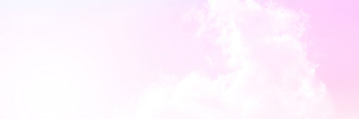 The Rainbow sky is Colorful sky with Soft clouds and a rainbow crossing. Fantasy magical sunny sky pastel background is fluffy white cloud. Freedom wallpaper concept. Sweet color dream.