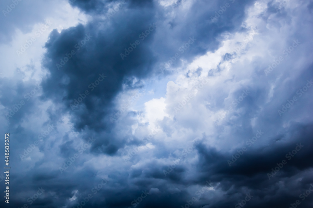 Poster the dark sky with heavy clouds converging and a violent storm before the rain.bad or moody weather s