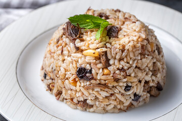 Traditional delicious Turkish food; rice pilaf with pine nuts and currants (Turkish name; ic pilav...