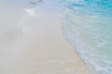 soft waves and sandy beach