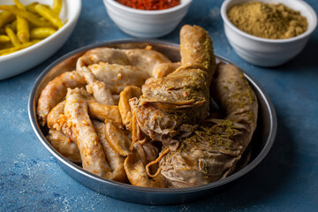 Traditional Turkish Stuffed rice tripe or offal food on the table in Turkish Restaurant. Shirdan Dolma is the favorite food Adana city of Turkey. (Turkish name; Sirdan)