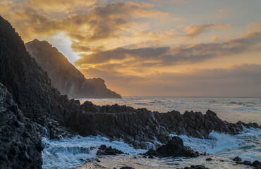Landscape of rock formation in Barronal beach in Cabo de Gata nature park, Spain, during sunrise