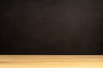Blank blackboard and wooden table. Empty background. Copy space