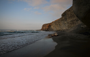 Broken old boat on a beach in summer