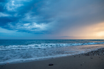 sea coast at sunset with stones