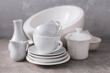 Obraz na płótnie Canvas Empty crockery set or white ceramic dishes. White kitchen dishware and tableware on table