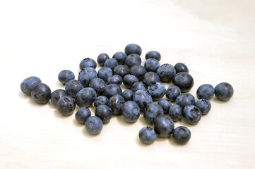 Fresh blueberries on a wooden background. The concept of healthy and dietary food.