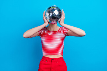 Photo portrait girl covered face with disco ball at party isolated vivid blue color background