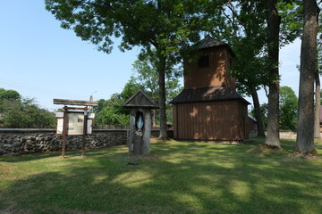 Narew, Poland - July 12, 2021: Orthodox brown church. Parish of the Assumption of the Blessed Virgin Mary and St. Stanislaus the Bishop and Martyr. Summer sunny day