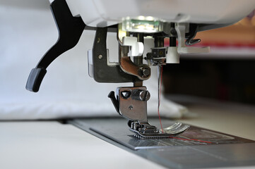 Closeup of a sewing machine ready for using. Tailoring concept.