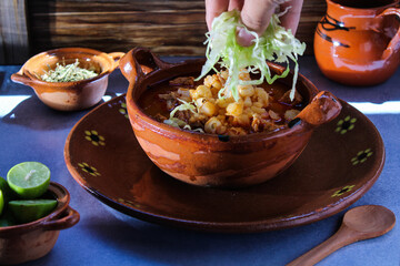 clay plate with pozole, traditional Mexican food