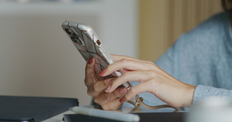 Woman use of mobile phone at home