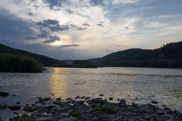 sunset among the clouds on the river