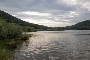 sunset among the clouds on the river