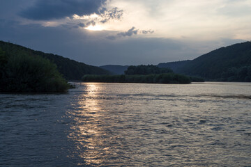 sunset among the clouds on the river