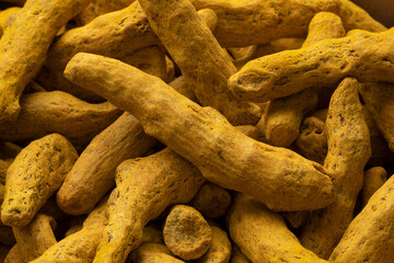 Dried yellow turmeric close up full frame as a background 