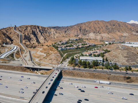 Sylmar, CA, LA County, July 27, 2021: Aerial View of Legends At Cascades Condominium Complex Sylmar with freeway interstate 5 and 210
