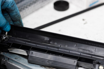 Disassembly of the toner cartridge for refilling. Restoration and maintenance in the service center of the printing device.
