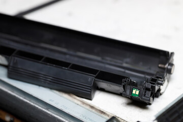 Disassembly of the toner cartridge for refilling. Restoration and maintenance in the service center of the printing device.