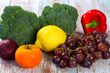 Fototapeta na wymiar Fresh vegetables appear on kitchen table. Healthy food close up