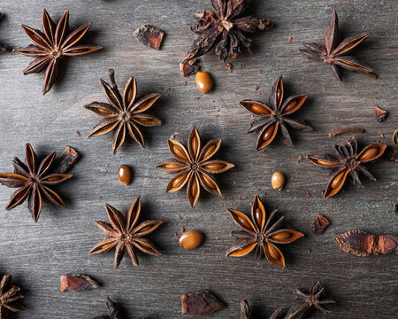 Anise stars on wooden table