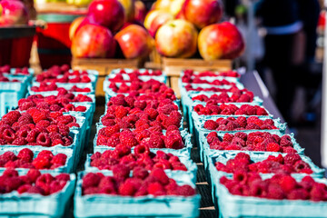 Raspberries and Apples for sale fresh at the farmer's market